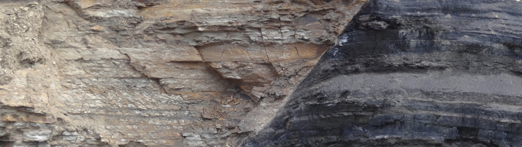 Normal fault with shale and sandstone on the left (hanging-wall) side and coal on the right (footwall) side.