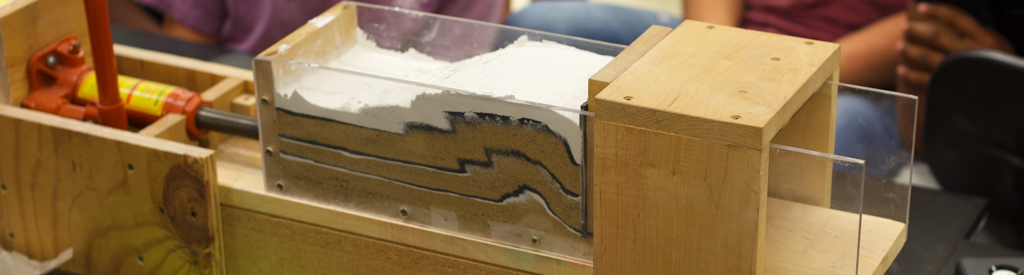 Sand-box physical model that produced contractional structures -- reverse faults and asymmetric folds