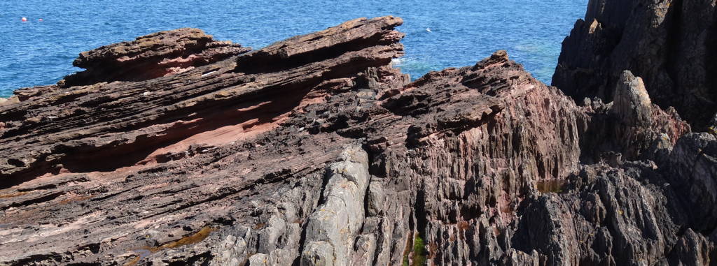 Outcrop of an angular unconformity at Siccar Point near Dunbar, Scotland.