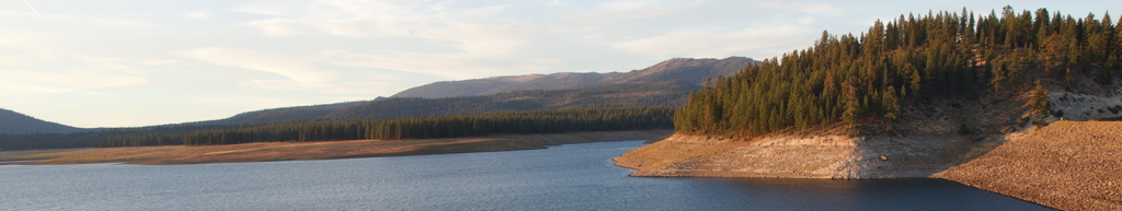 Sunset at Stampede Reservoir, with Stampede Dam at the lower right corner.